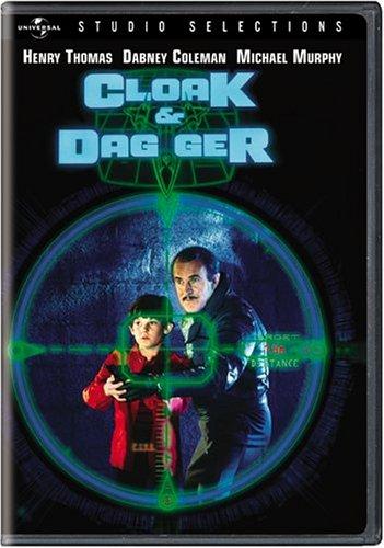 The DVD cover for Cloak & Dagger (1984) featuring actors Henry Thomas and Dabney Coleman viewed through the cross-hairs of a futuristic sniper rifle sight.