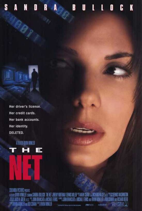 The movie poster for The Net (1995), featuring actor Sandra Bullock's face obscured by shadows.